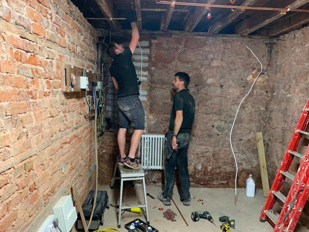 Fitting pipes in old basement