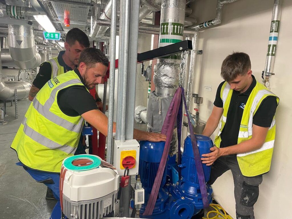 Team lifting large motors